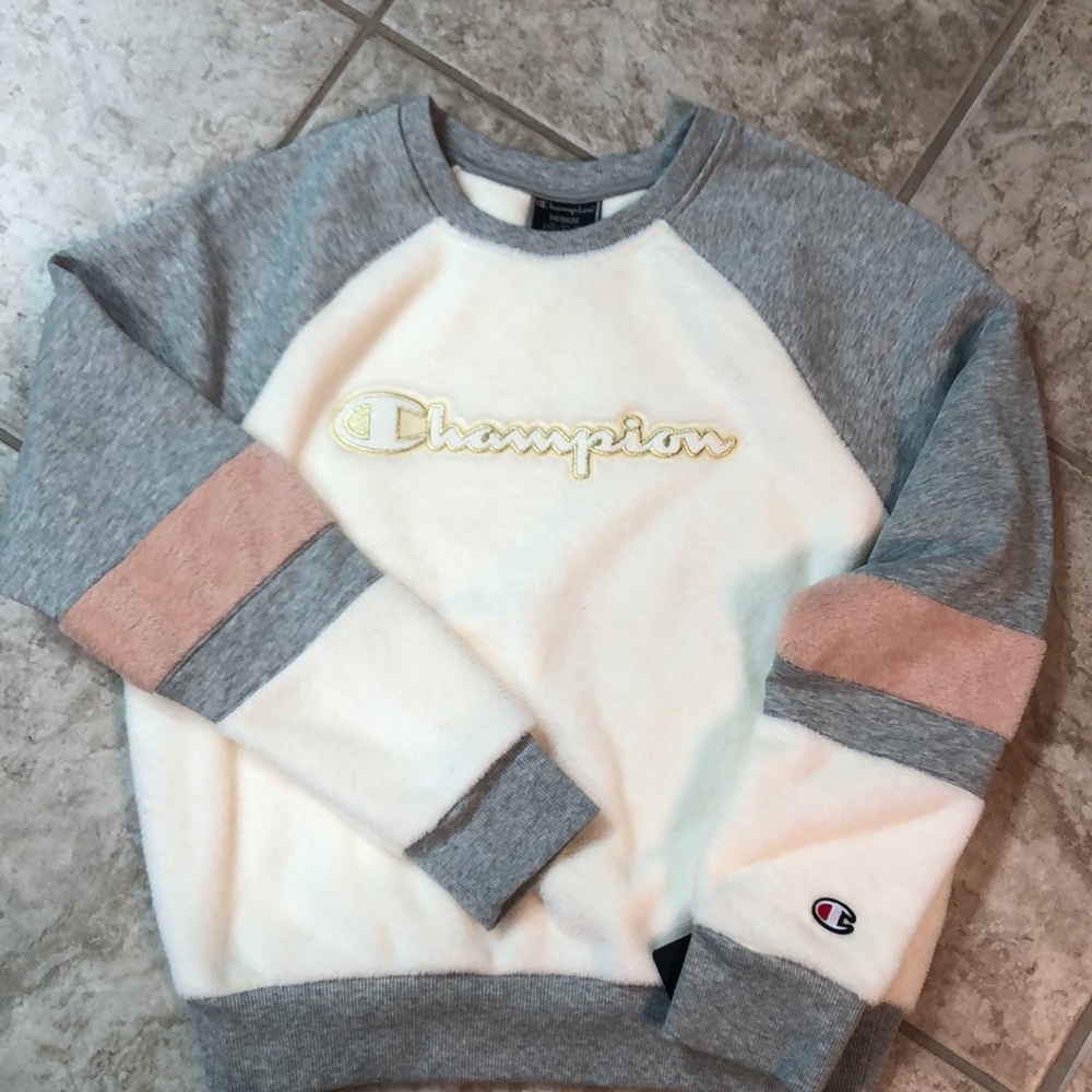 Champion: White Super Fleece Champion sweatshirt.